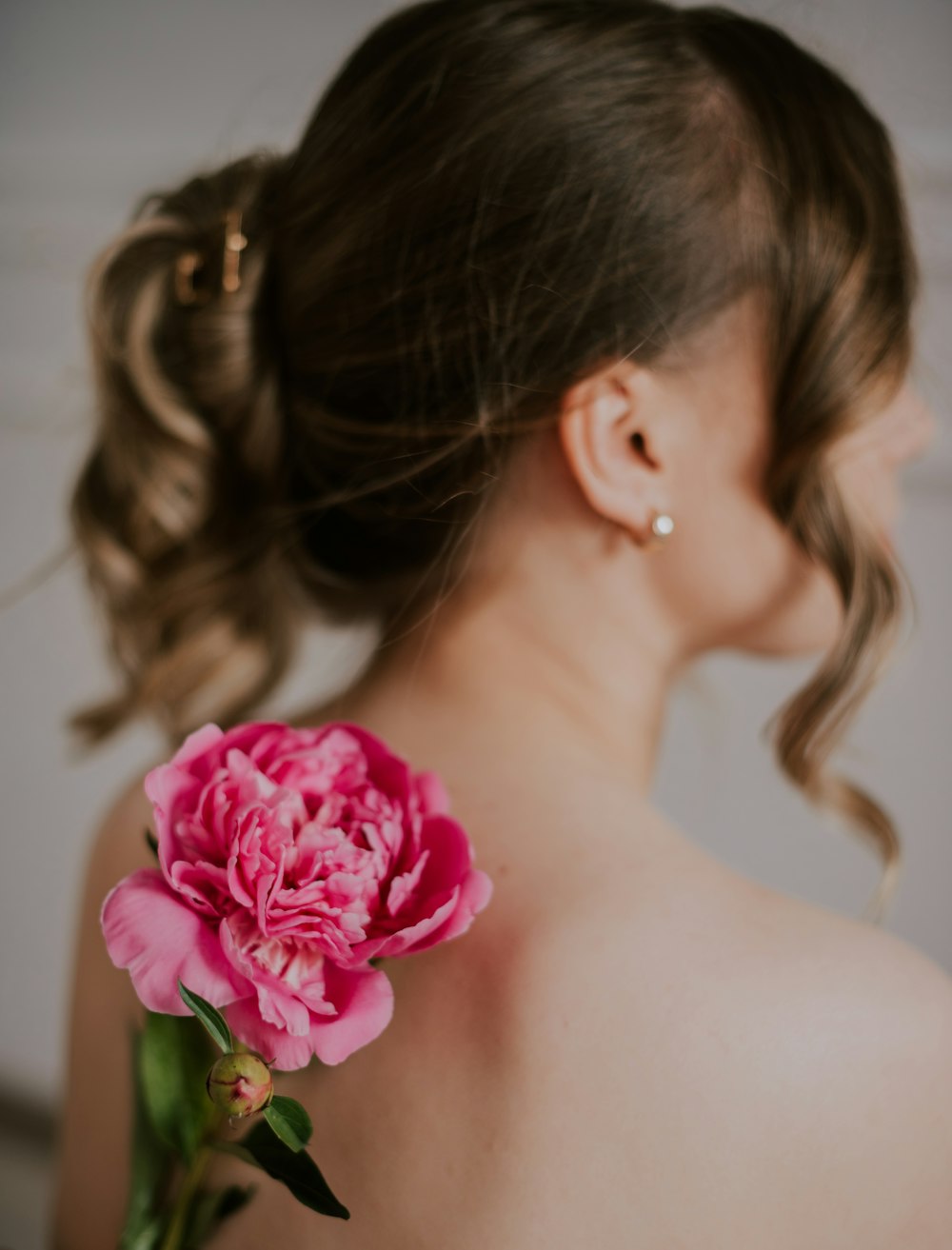 a woman with a flower in her hair