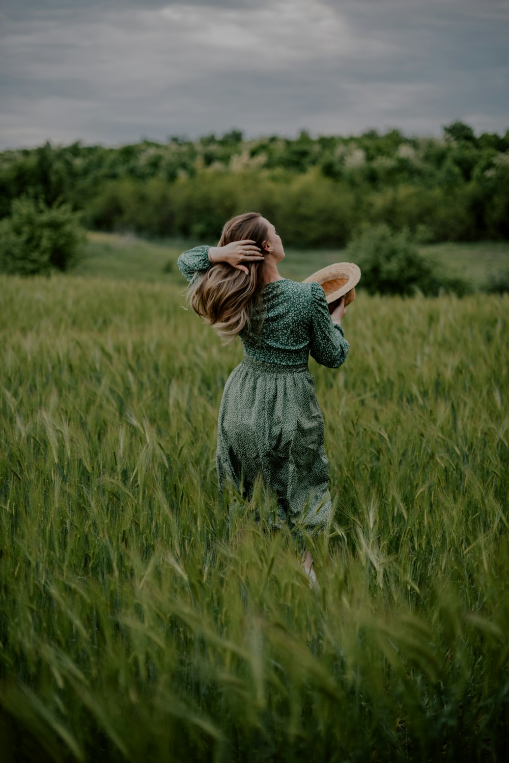 a little girl in a field with a frisbee