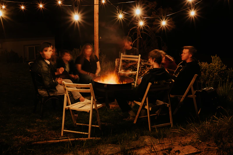 People meeting around a fire pit