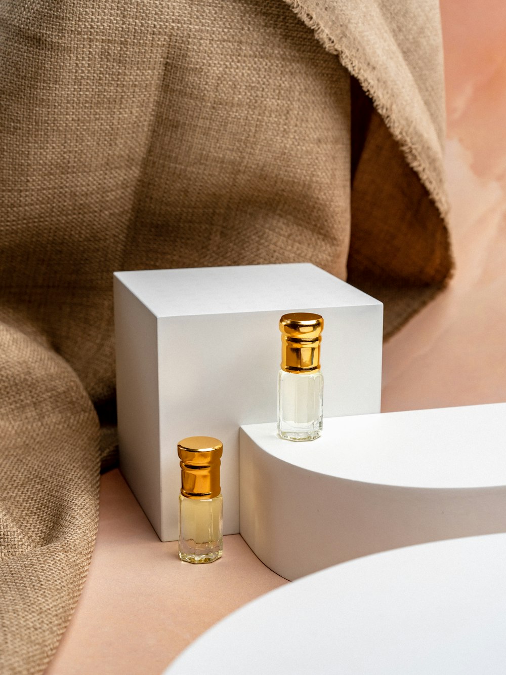 a couple of bottles of perfume sitting on top of a table