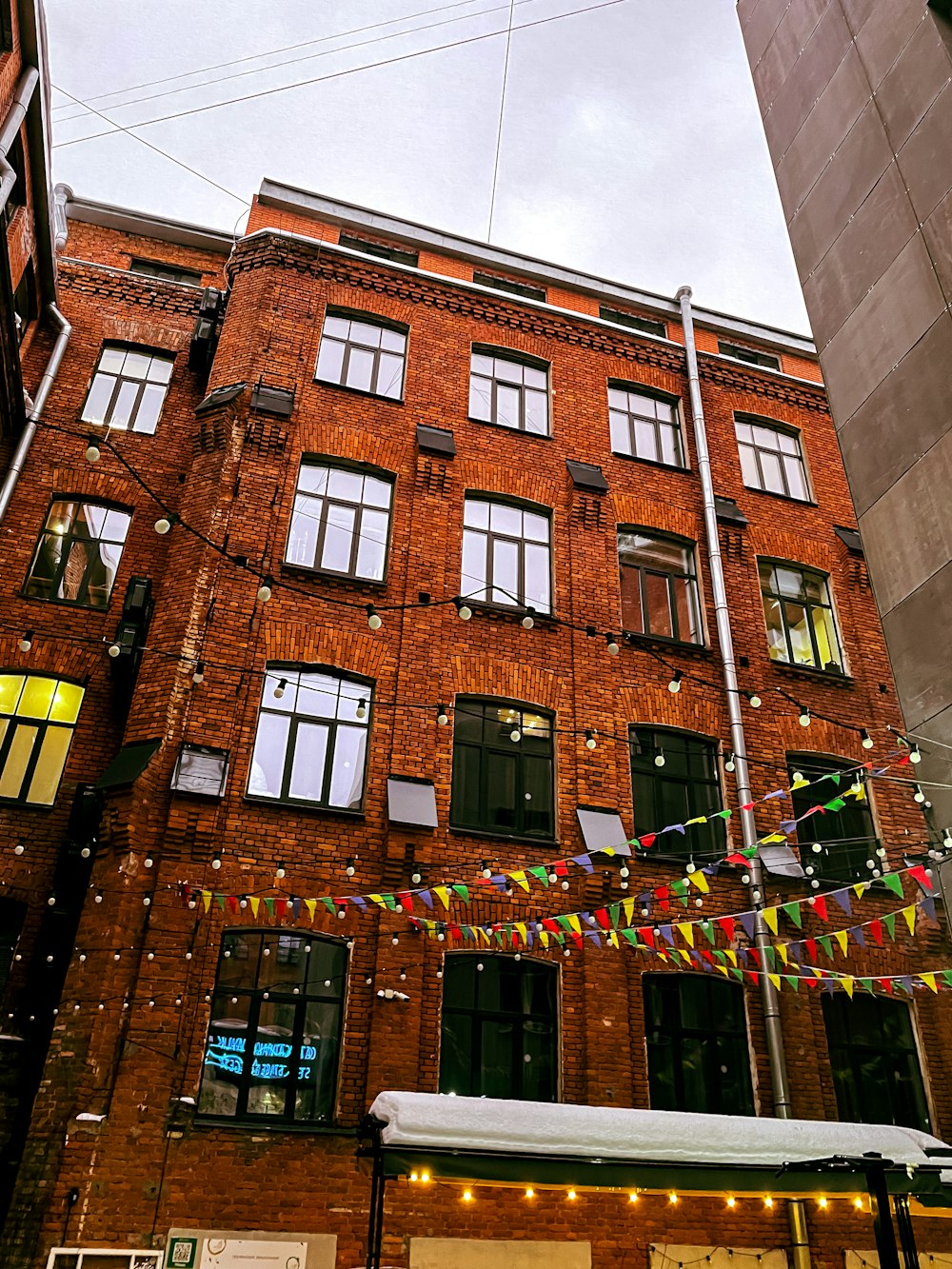 a tall brick building with lots of windows