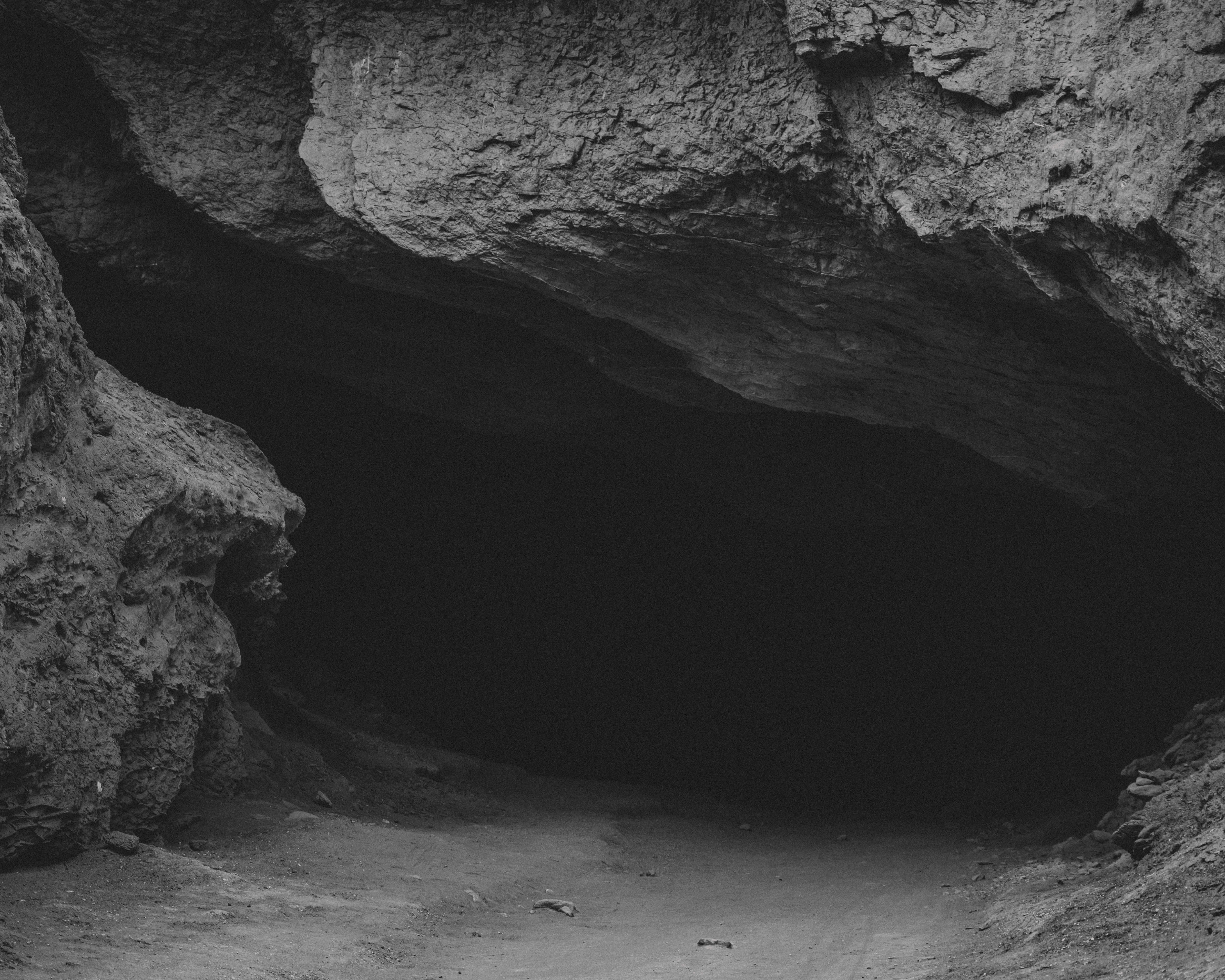 a black and white photo of a cave