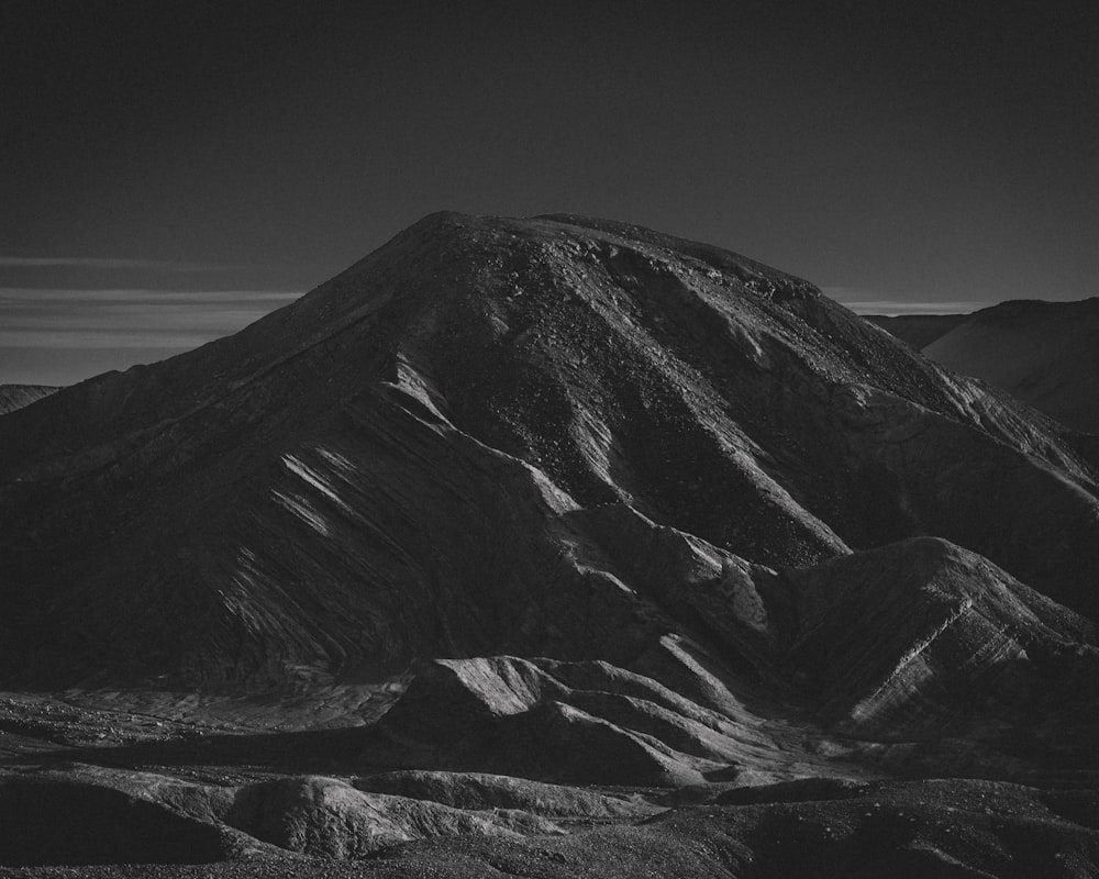 a black and white photo of a mountain