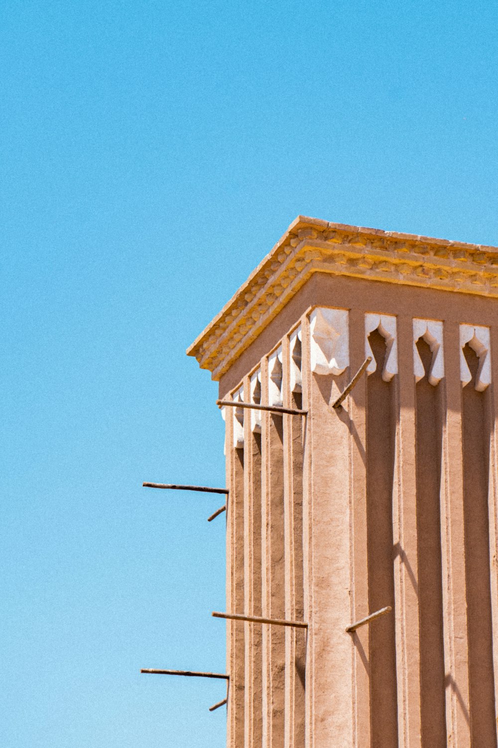 a tall building with a clock on the side of it