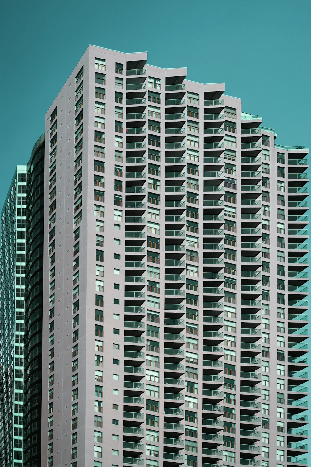 a very tall building with many windows and balconies