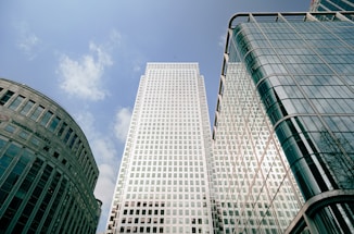 a couple of tall buildings sitting next to each other