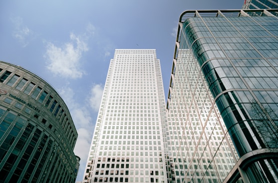 a couple of tall buildings sitting next to each other