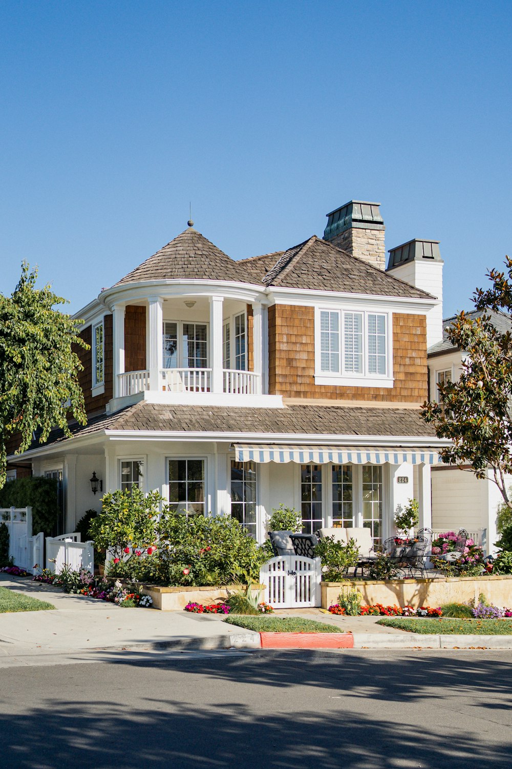 a large white house with a brown roof