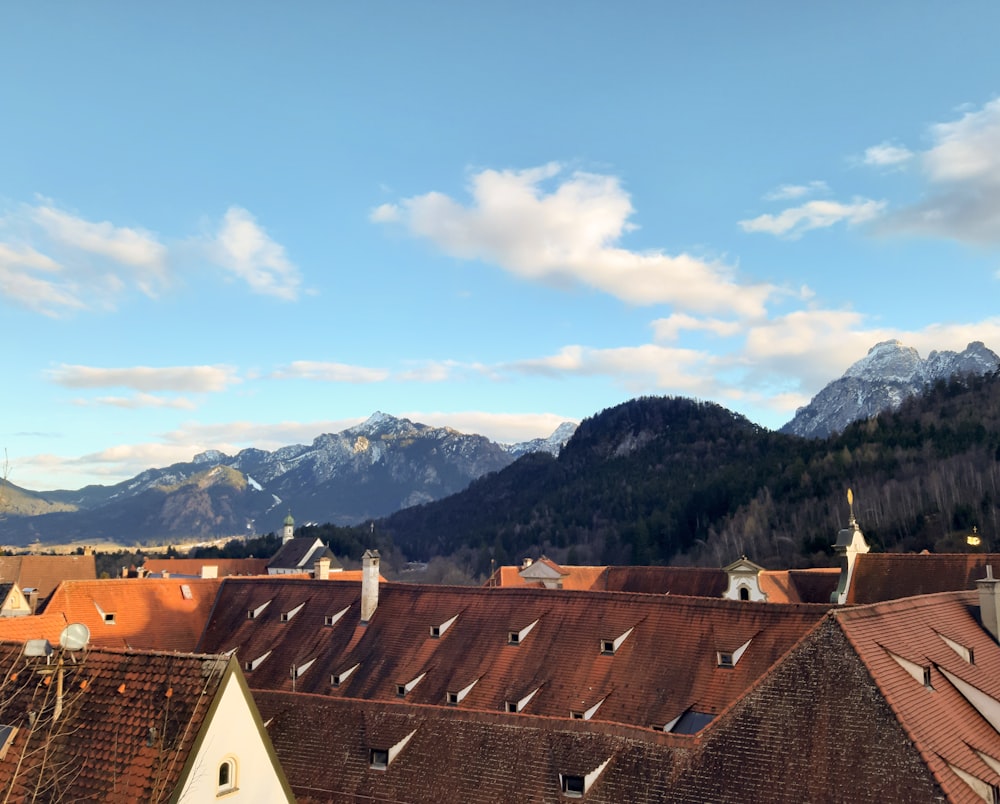 a view of a mountain range from a rooftop