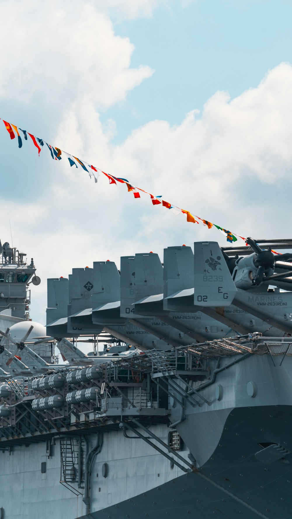 a large aircraft carrier sitting on top of a ship