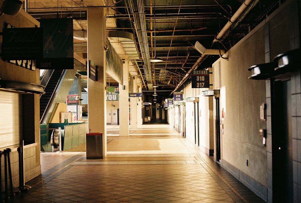 a long hallway with a tiled floor and ceiling