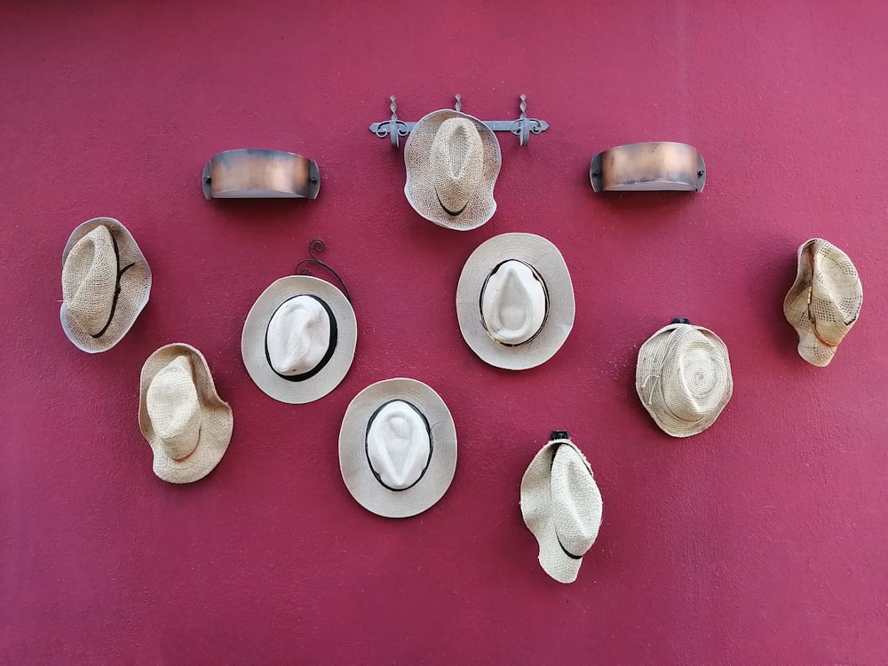 a group of hats hanging on a wall