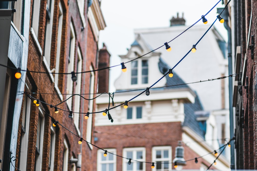 a string of lights hanging from the side of a building