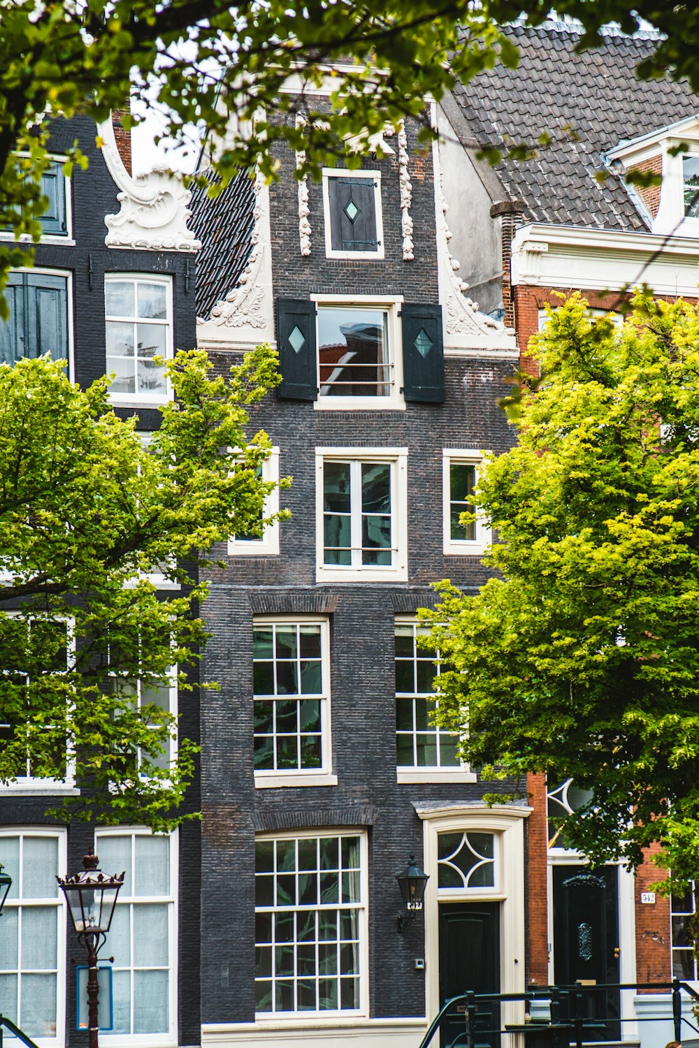 a building with many windows and a clock on the front of it