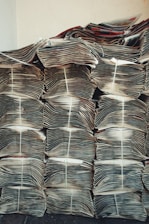 stacks of papers stacked on top of each other