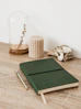 a green notebook sitting on top of a wooden table