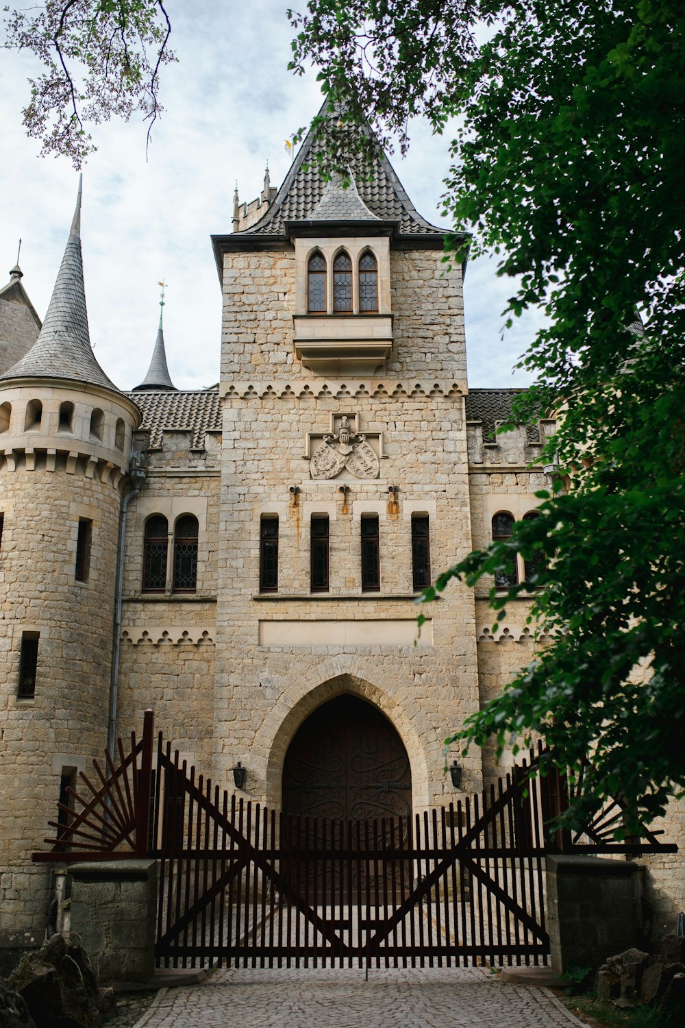 a castle with a gate and a clock tower