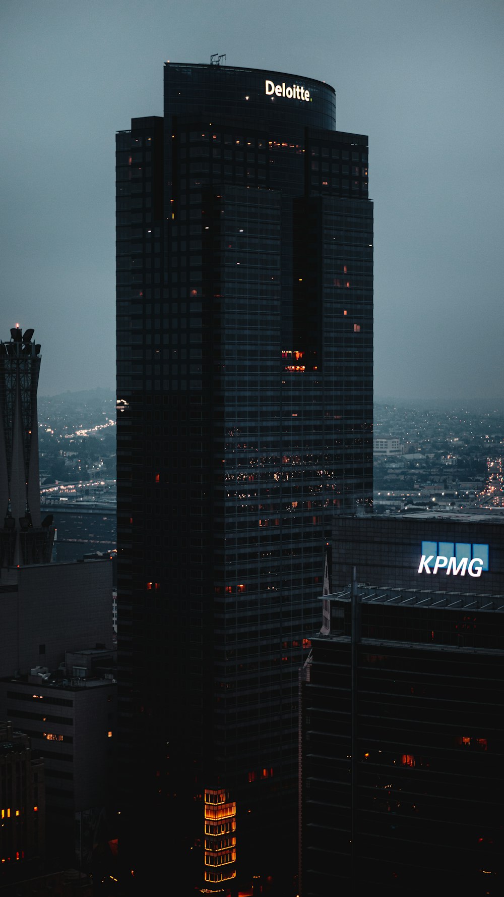 a tall building with a sign on top of it