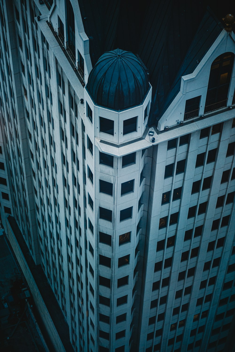 a very tall building with a blue dome on top