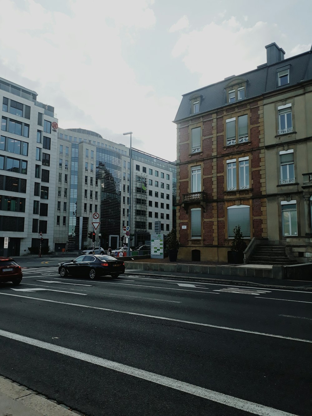 a couple of cars that are sitting in the street