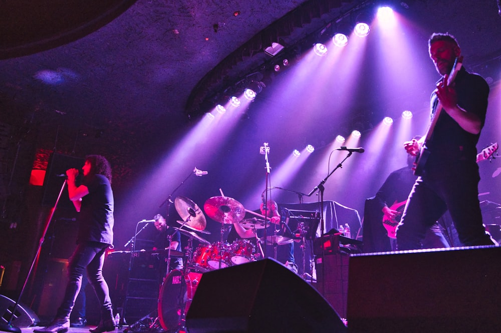 a group of people on stage playing instruments