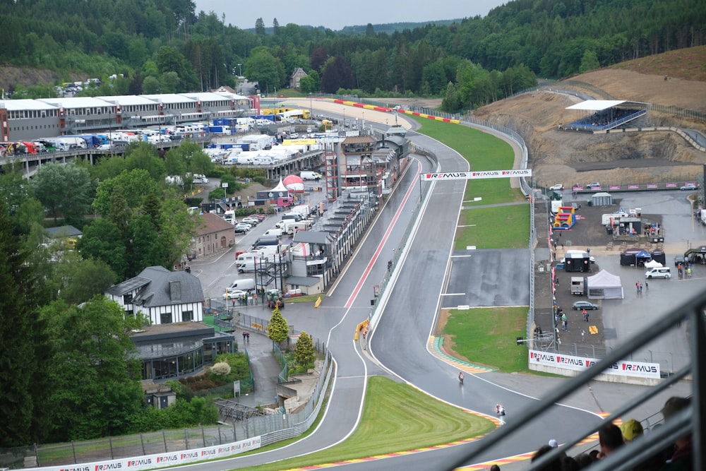 an aerial view of a race track with cars on it