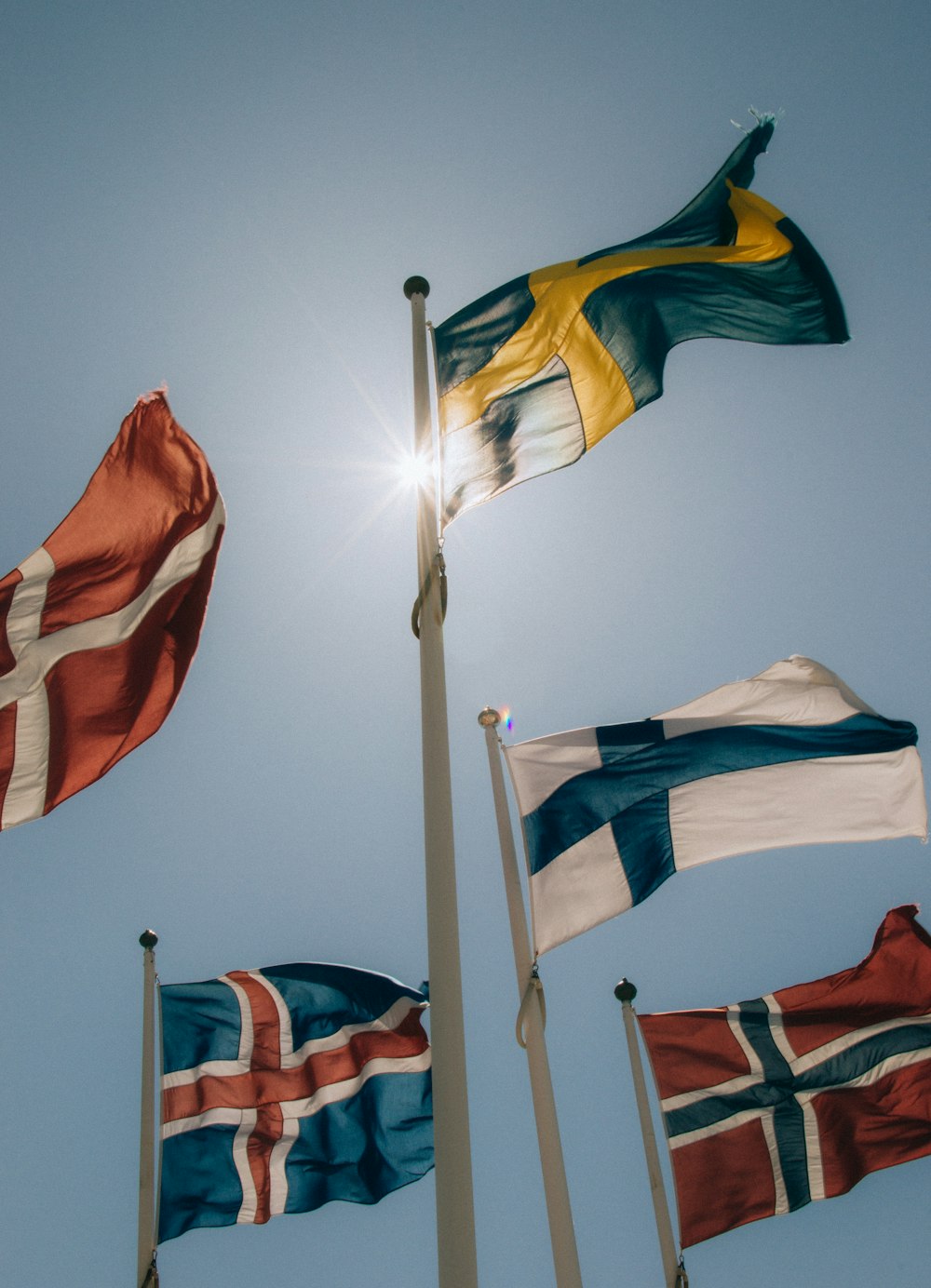 a group of flags that are flying in the air