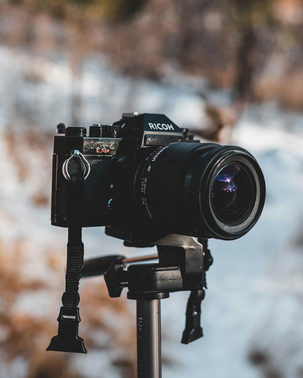 a camera sitting on top of a tripod