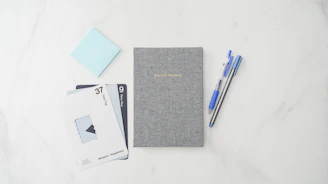 Close-up of elegant Japanese stationery items with subtle blue accents.