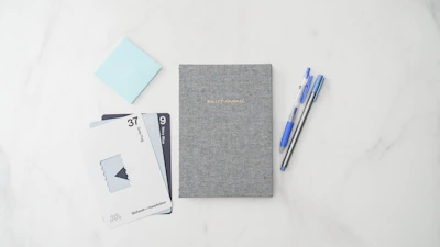 Close-up of elegant Japanese stationery items with subtle blue accents.