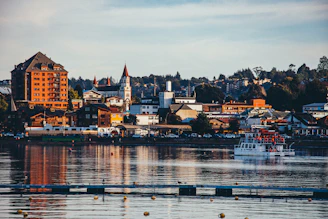 a large body of water with a city in the background