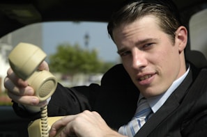 Close-up of an attorney speaking on the phone, ready to assist a driver with their case.