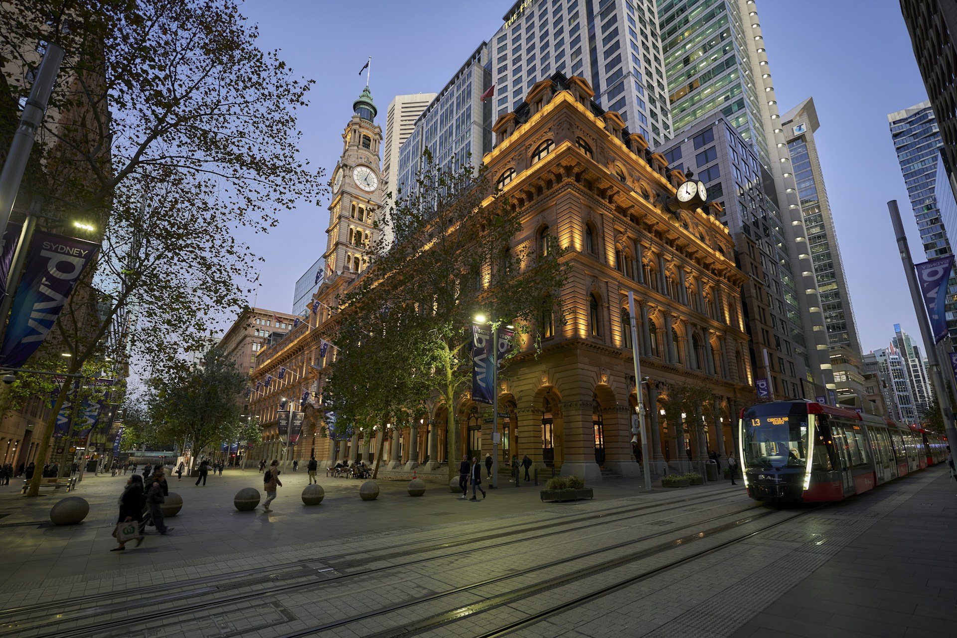 a street scene with a trolley and a building