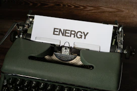 a close up of a typewriter with a sign on it