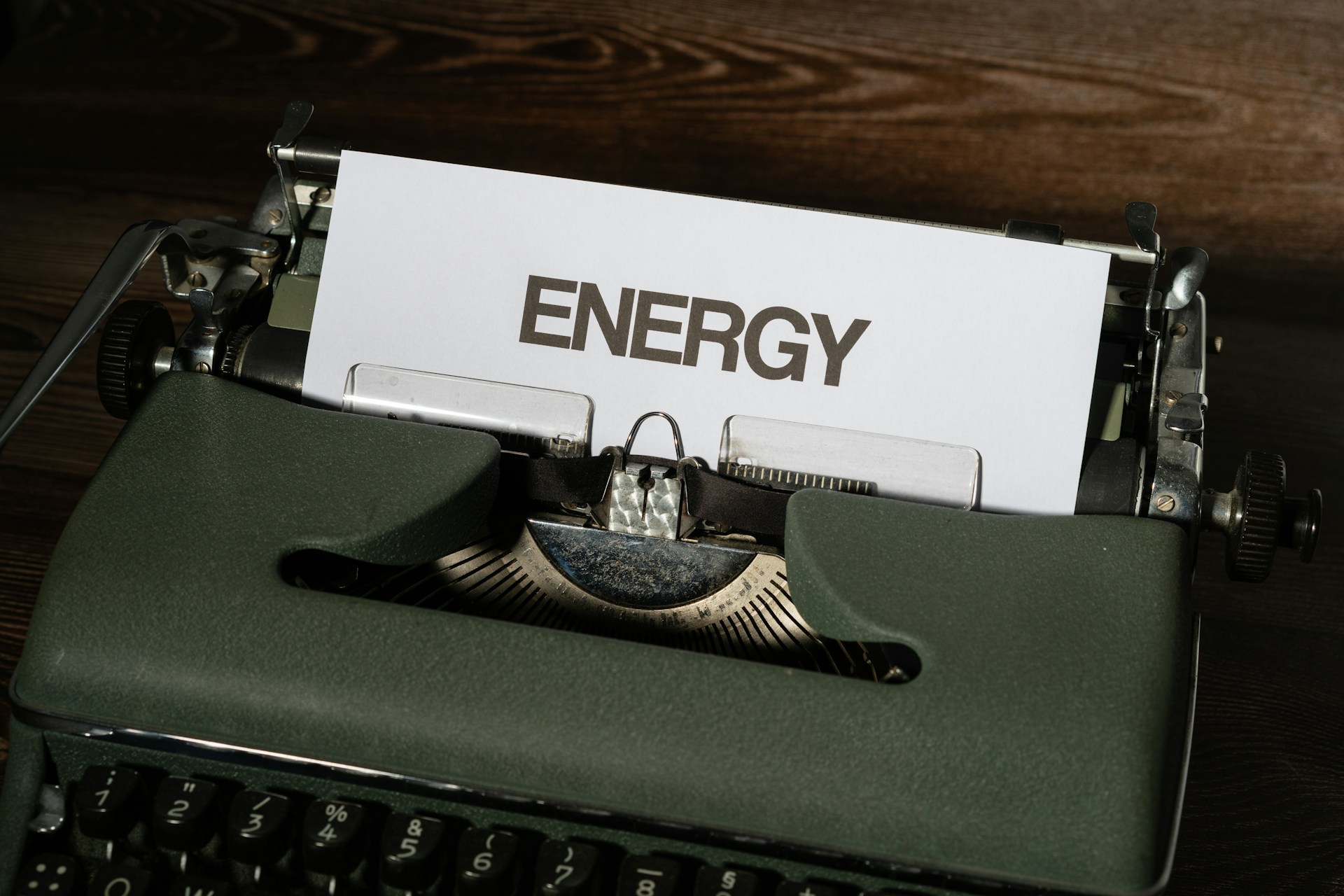 a close up of a typewriter with a sign on it