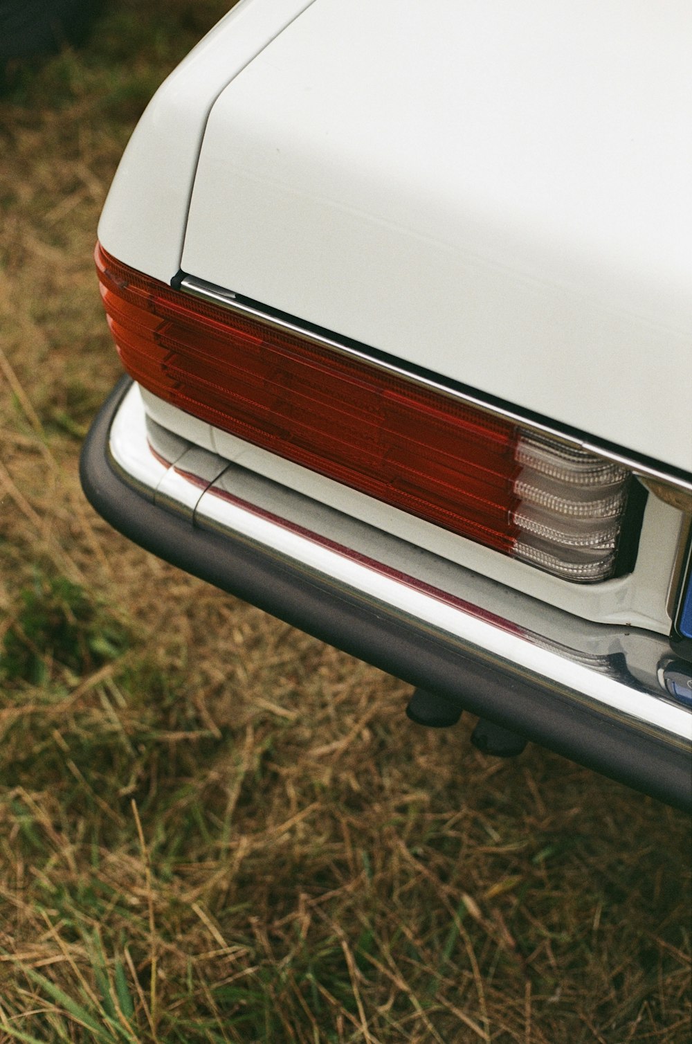 a close up of the tail light of a white car