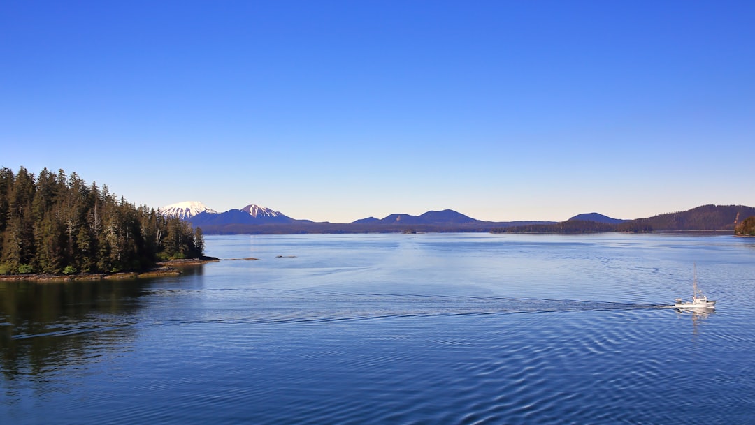 a boat traveling on a large body of water, Panoramic Alaska