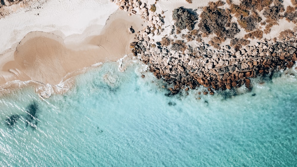 a bird's eye view of a beach and water