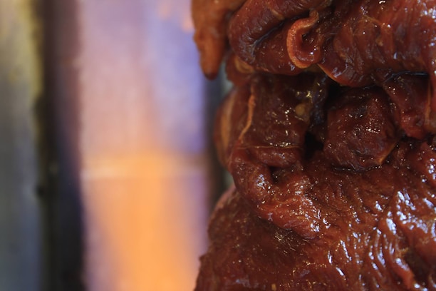 Close-up of marinated meat cuts perfectly arranged for wholesale delivery.