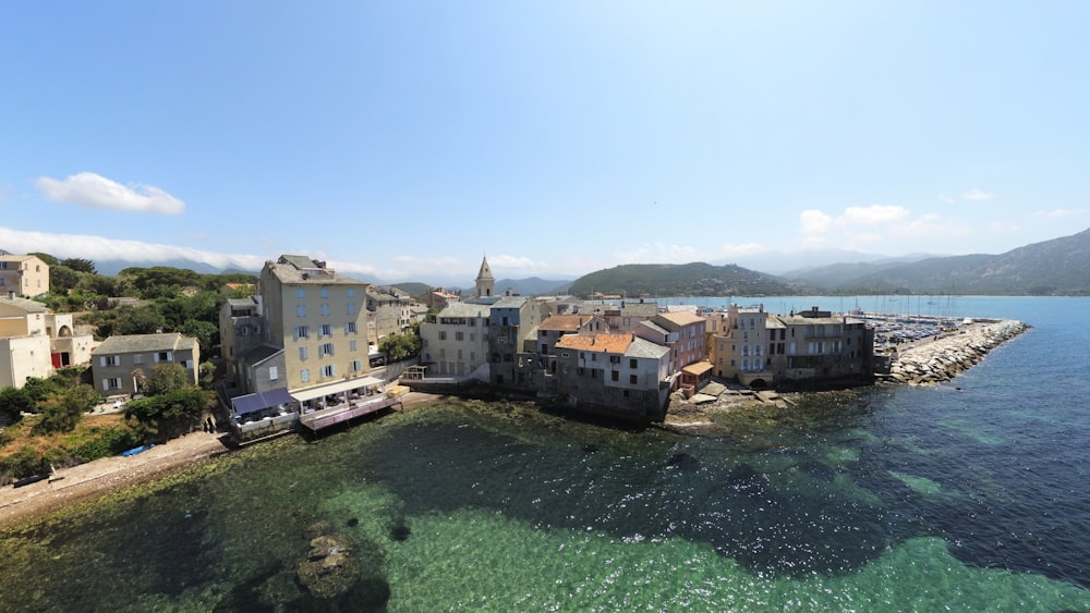 an aerial view of a small town by the water