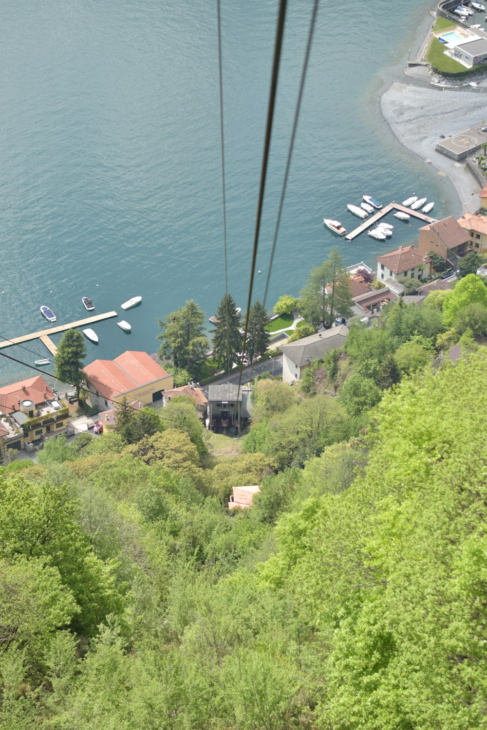 a view of a lake from a cable car