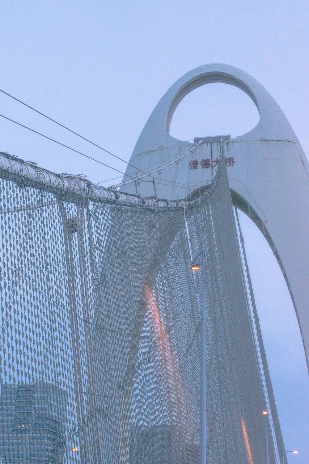 a traffic light sitting on the side of a bridge