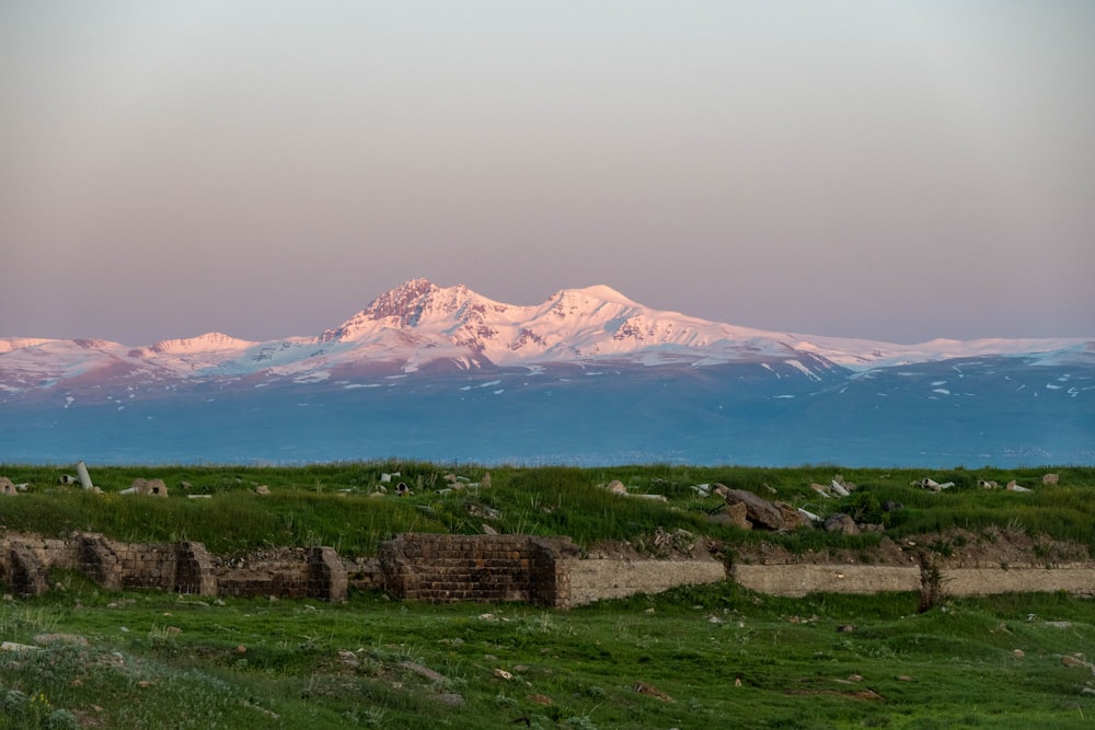 a snow covered mountain range in the distance