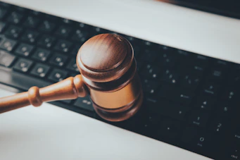 a wooden gaven sitting on top of a computer keyboard