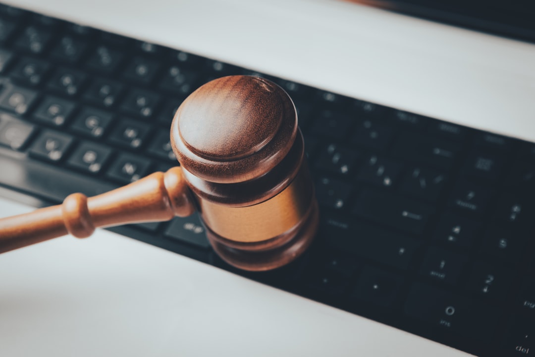 a wooden gaven sitting on top of a computer keyboard