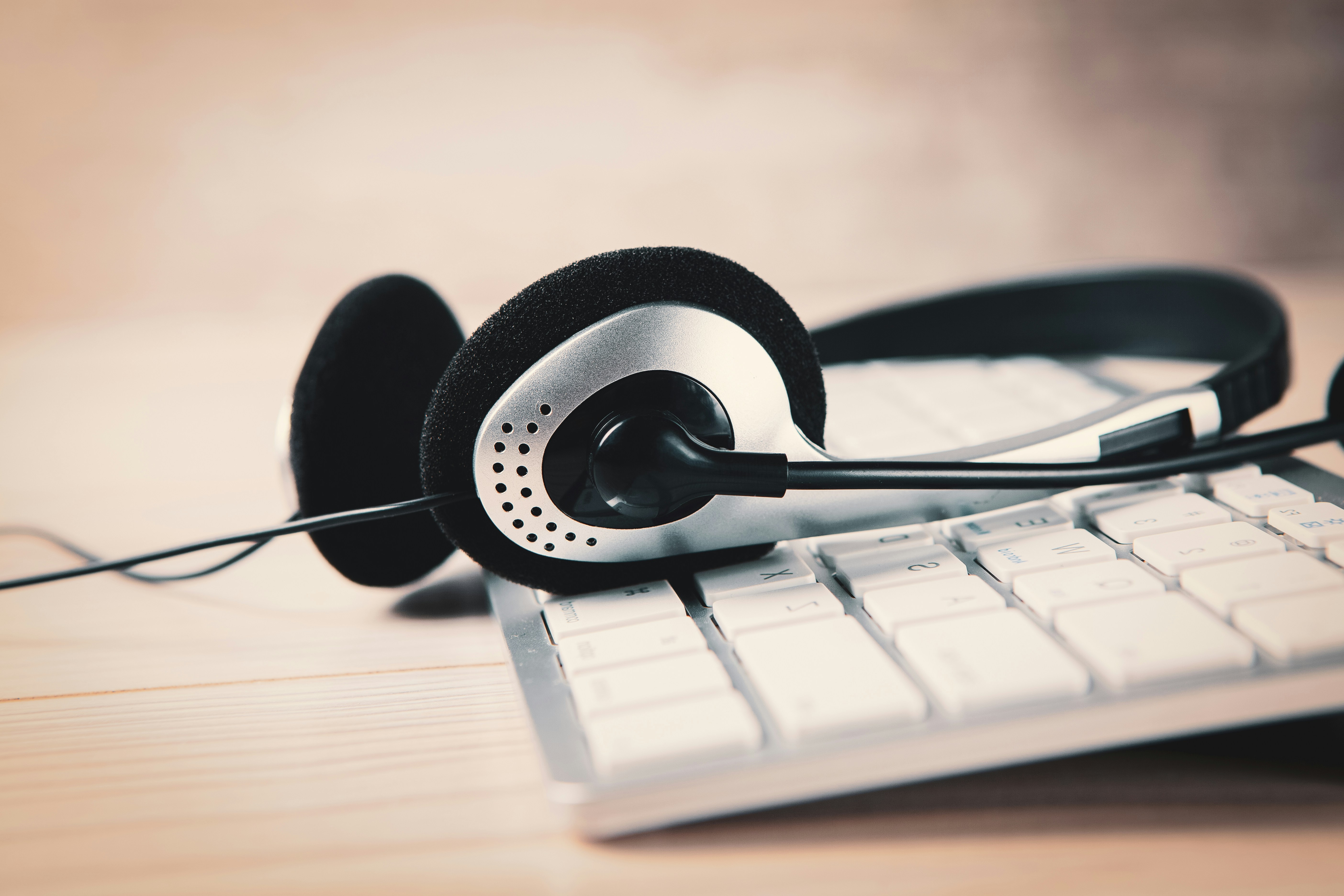 a pair of headphones sitting on top of a keyboard