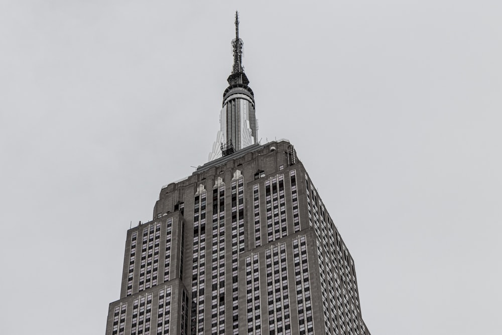 a very tall building with a clock on the top