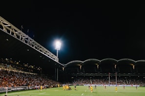 A dynamic shot of a rugby match at Sevens Stadium.