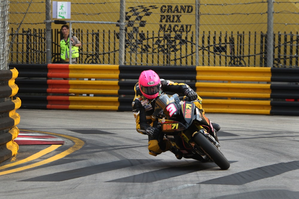 a person riding a motorcycle on a race track