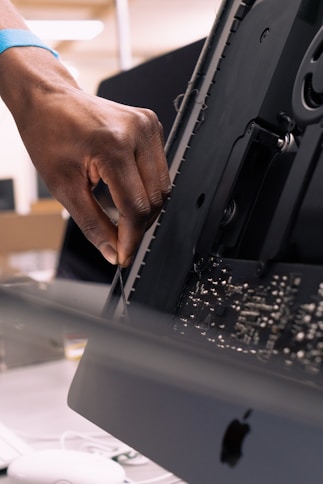 a person is working on a computer in a room